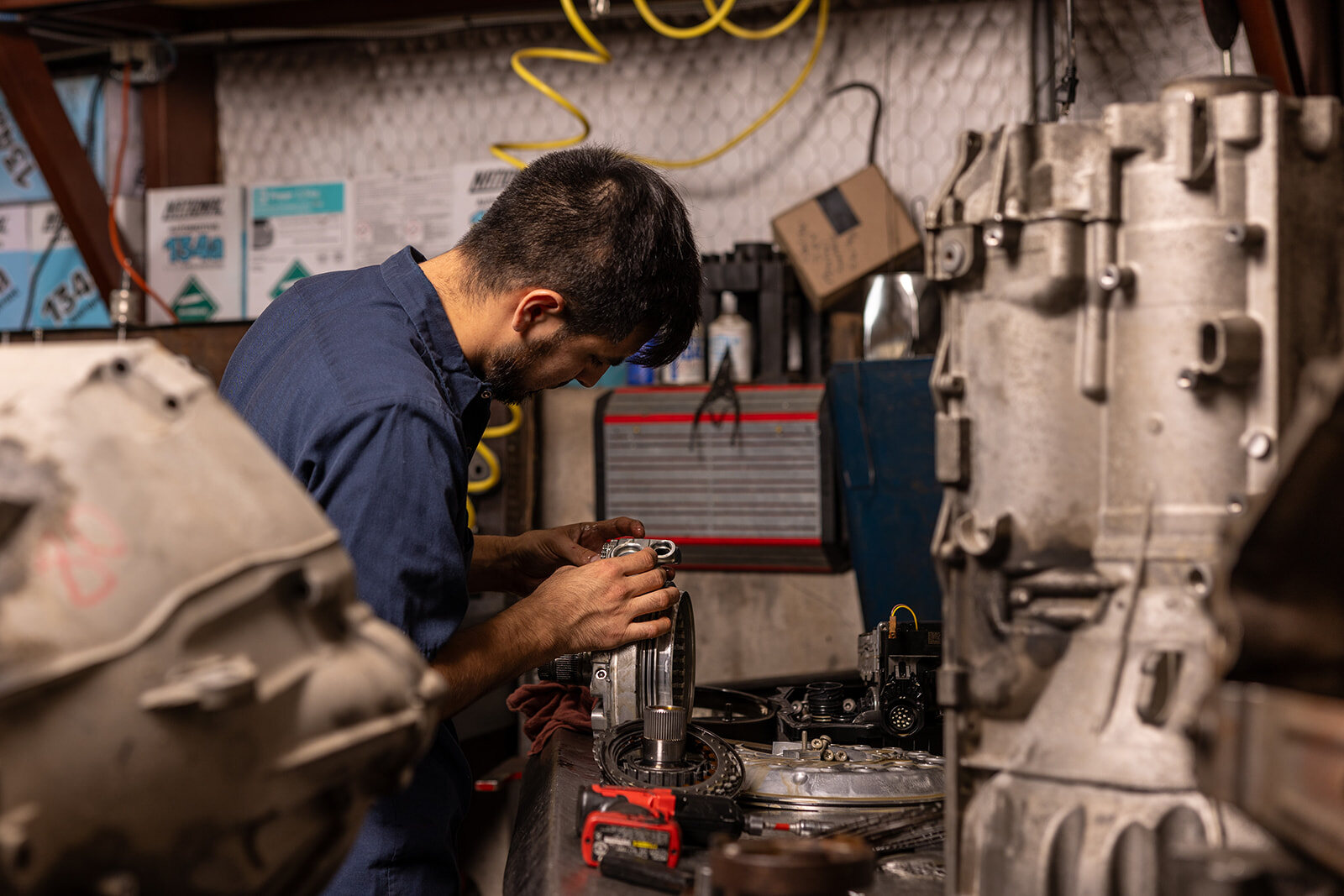 Technician working in an automotive shop, photographed on location